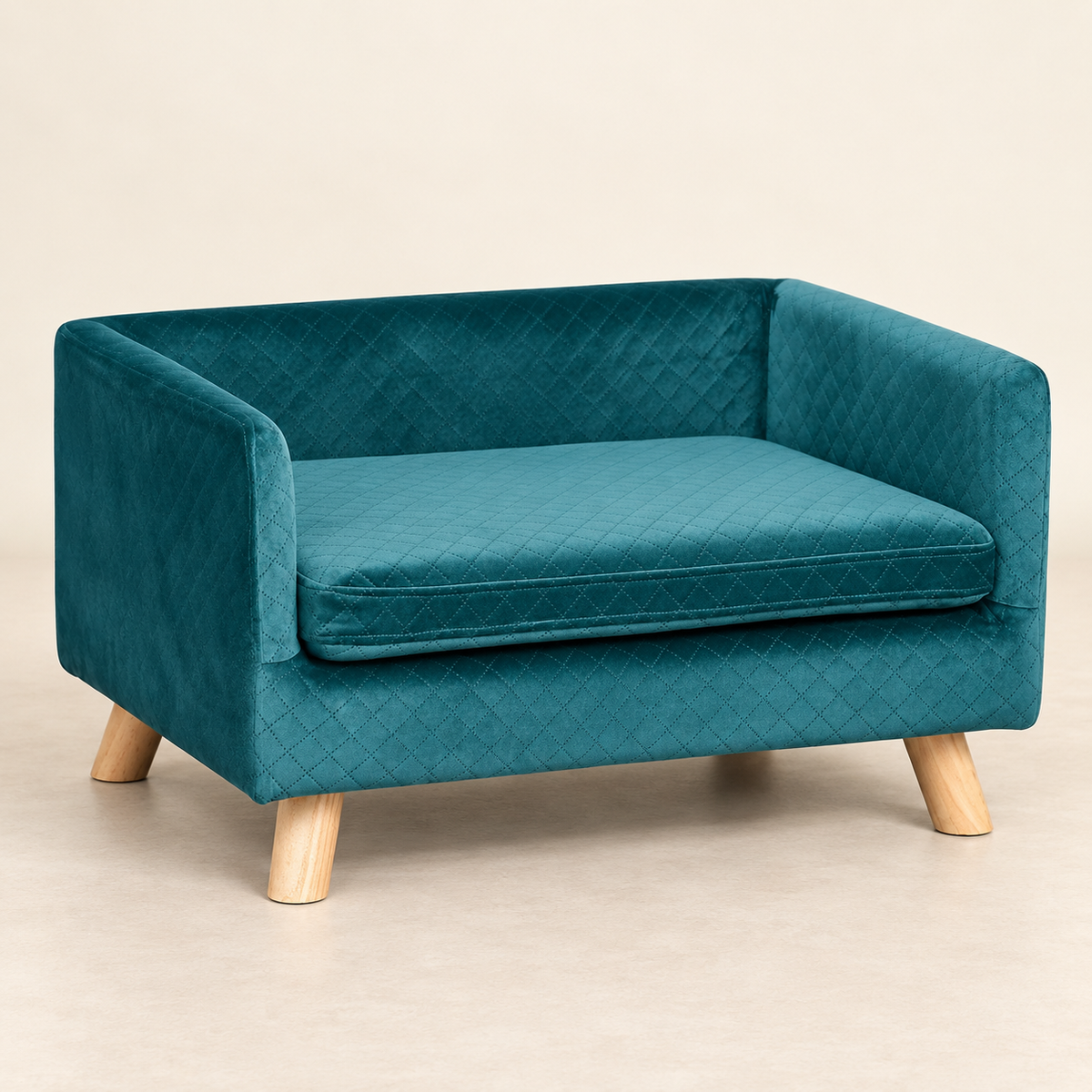 Sofa scandinave pour petit chien en velours bleu canard, vue studio